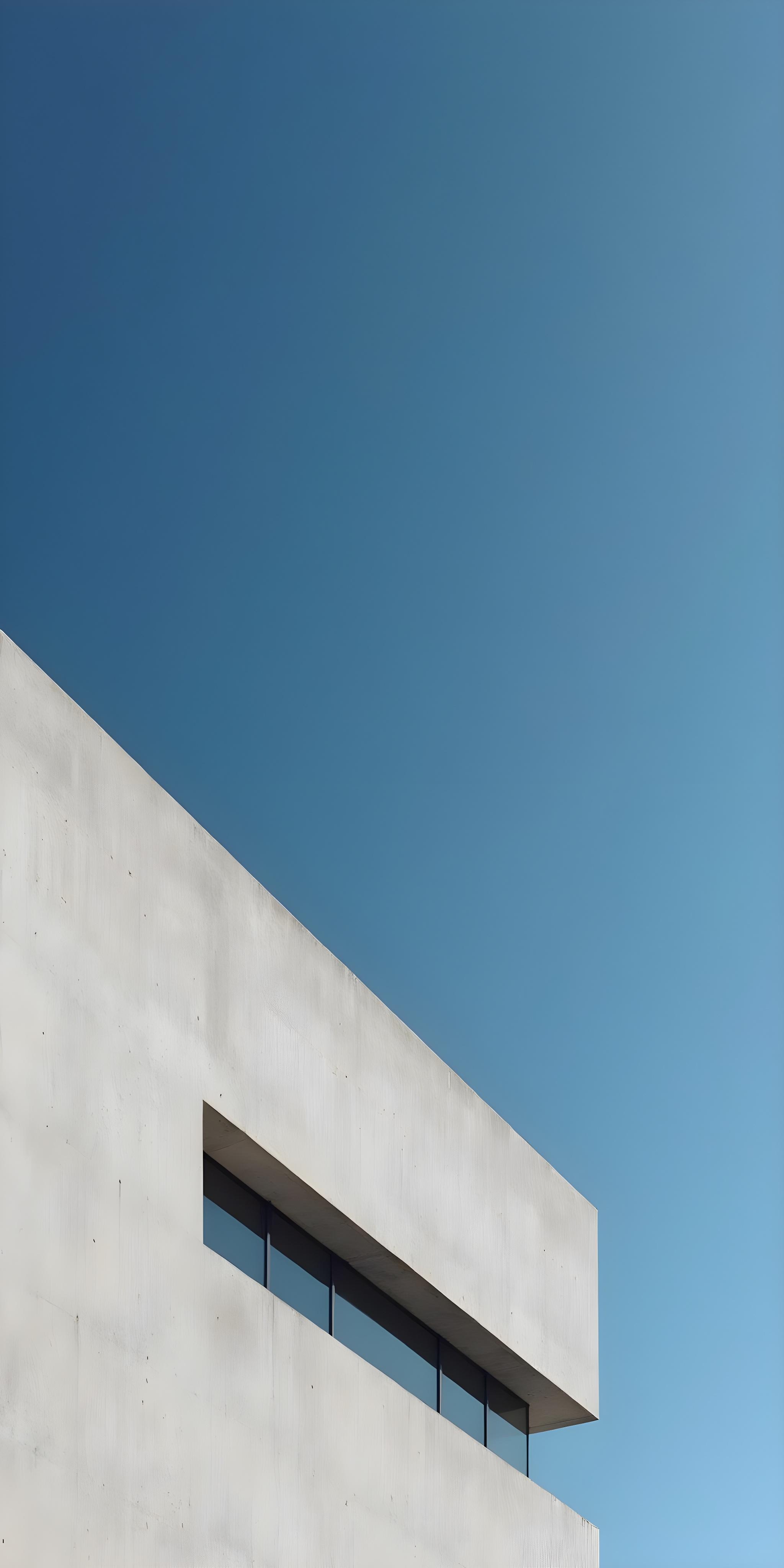 Concrete wall against deep blue sky